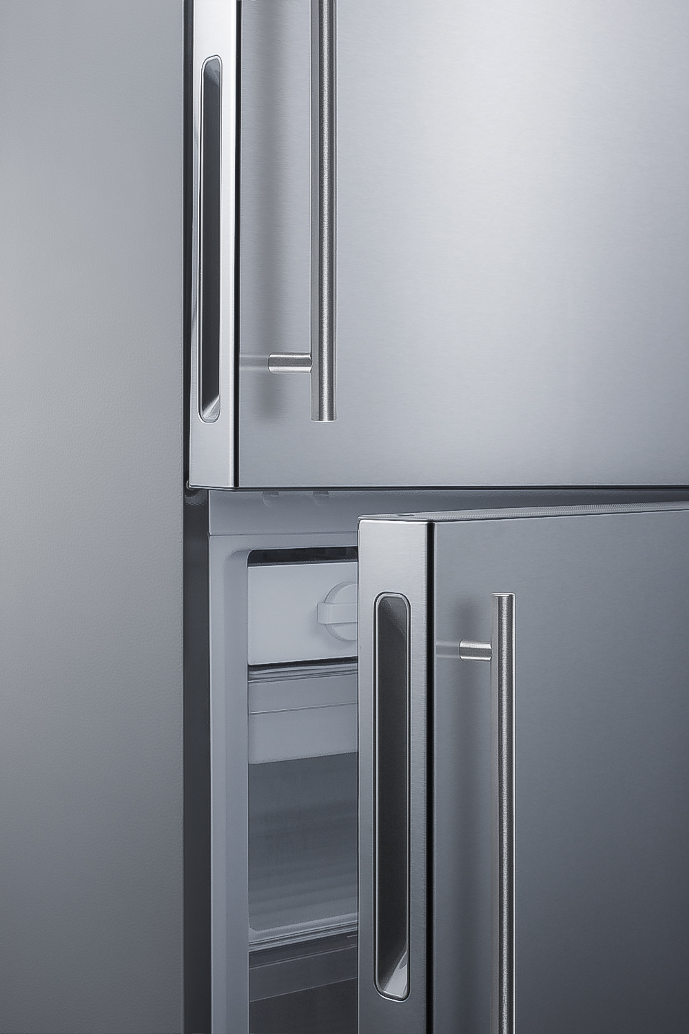 Frost-free bottom freezer refrigerator in stainless steel with factory-installed icemaker and digital controls and a counter depth fit